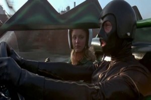 David Carridine in a gimp suit at the controls of a car shaped like an alligator. This movie can't be all bad.