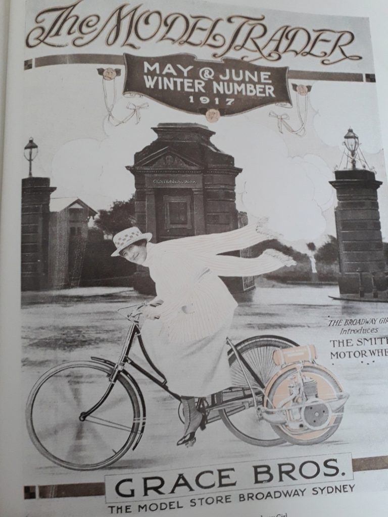 Edwardian woman on motorised bicycle
